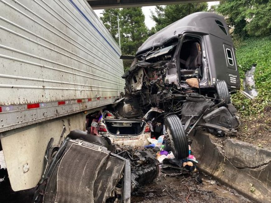 Photos: Ore. driver survives crash with tractor-trailer