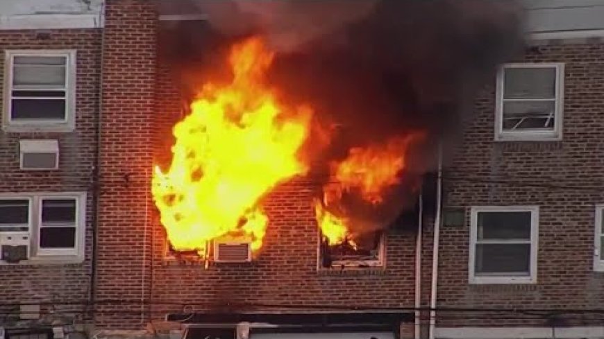 Pa. cop catches baby dropped from window as mother jumps to escape rowhome fire