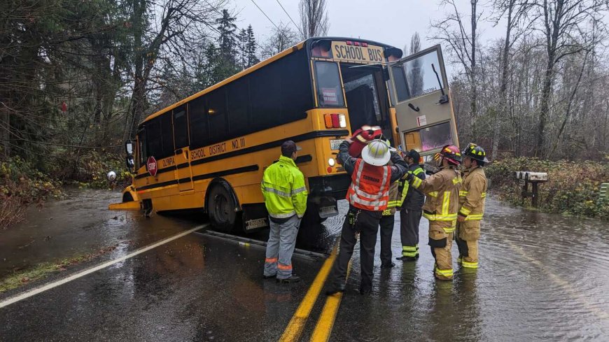 Photos: Wash. firefighters rescue children from school bus stuck in flood waters